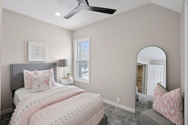 carpeted bedroom with lofted ceiling, baseboards, and a ceiling fan