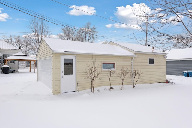 snow covered structure with an outdoor structure