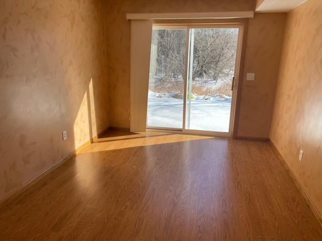 empty room with light wood finished floors