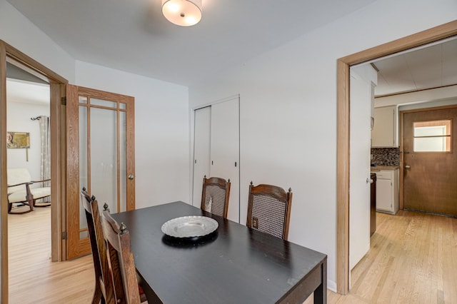 dining room with light wood finished floors