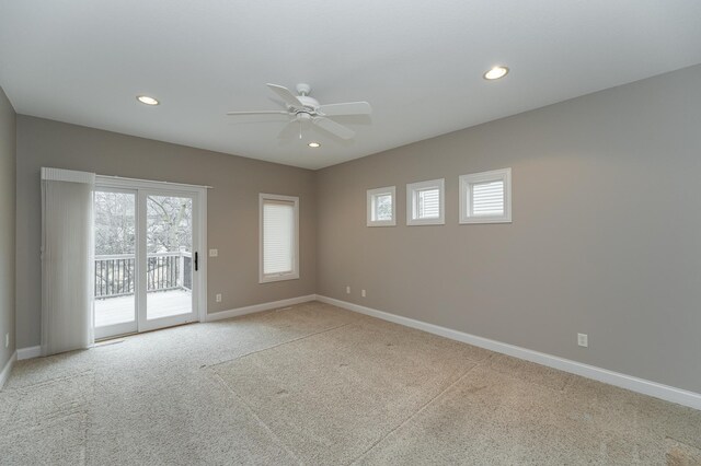 unfurnished room with a ceiling fan, recessed lighting, a healthy amount of sunlight, and baseboards