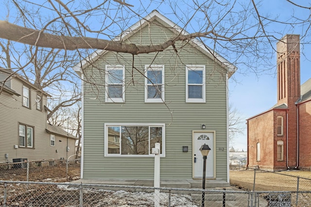 view of front of property featuring a fenced front yard and central AC unit