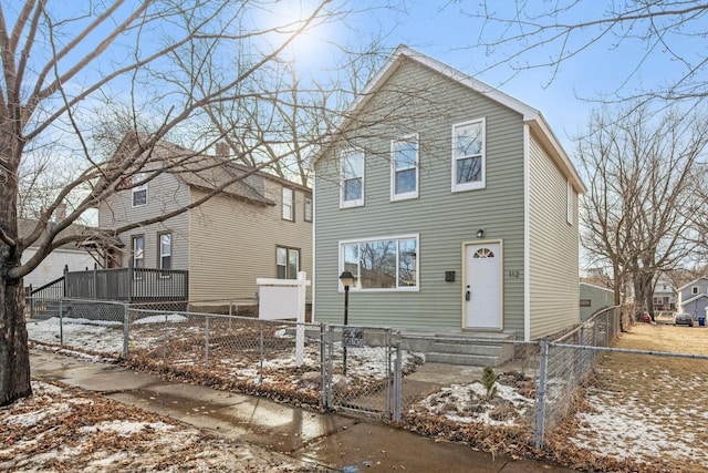 view of front of house with a fenced front yard and a gate