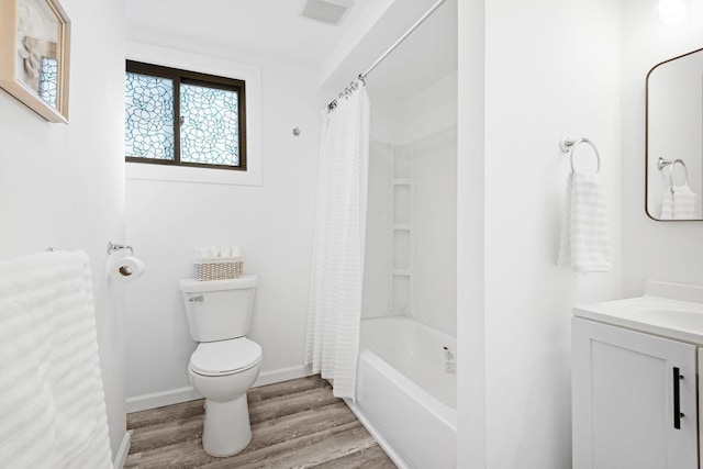 full bathroom with shower / bath combination with curtain, visible vents, toilet, vanity, and wood finished floors