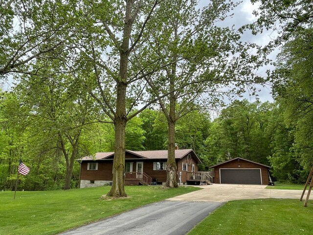 19241 Ebony Rd, Osakis, MN 56360 - view of front of home featuring an outbuilding, a garage, and a front lawn