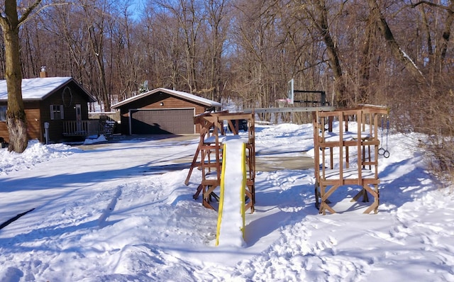 19241 Ebony Rd, Osakis, MN 56360 - yard covered in snow featuring a garage and an outbuilding