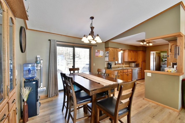 19241 Ebony Rd, Osakis, MN 56360 - dining room featuring a chandelier, light wood finished floors, crown molding, and a textured ceiling