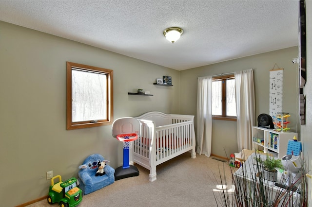 19241 Ebony Rd, Osakis, MN 56360 - bedroom with carpet, a nursery area, a textured ceiling, and baseboards