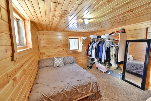 19241 Ebony Rd, Osakis, MN 56360 - carpeted bedroom featuring wooden walls, a closet, and wood ceiling