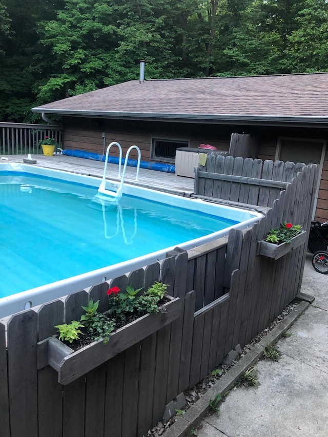 19241 Ebony Rd, Osakis, MN 56360 - view of swimming pool featuring a forest view