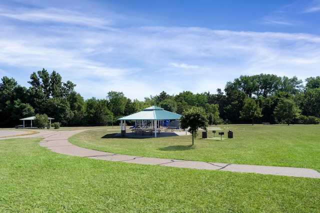 surrounding community with a gazebo and a lawn