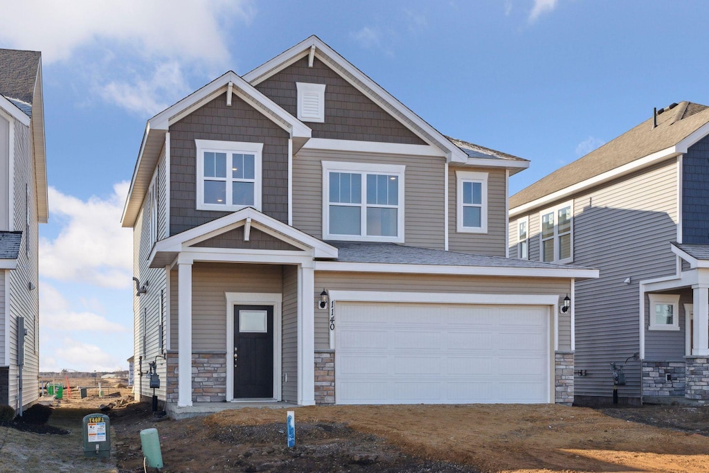 1181 150th St W, Rosemount, MN 55068 - craftsman-style home with a garage and stone siding