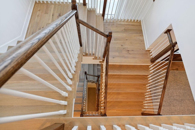 staircase featuring wood finished floors