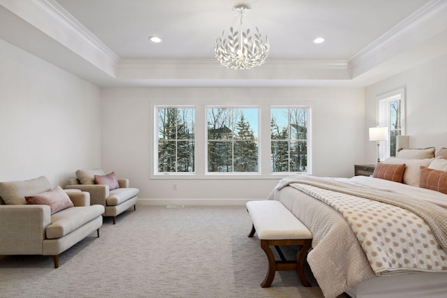 carpeted bedroom featuring a tray ceiling, multiple windows, and crown molding