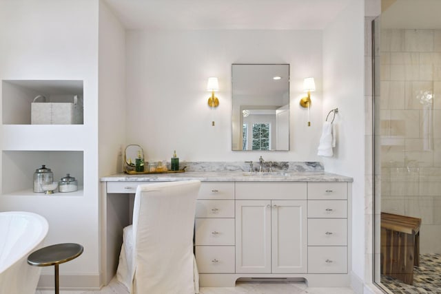 bathroom featuring a freestanding bath, tiled shower, and vanity