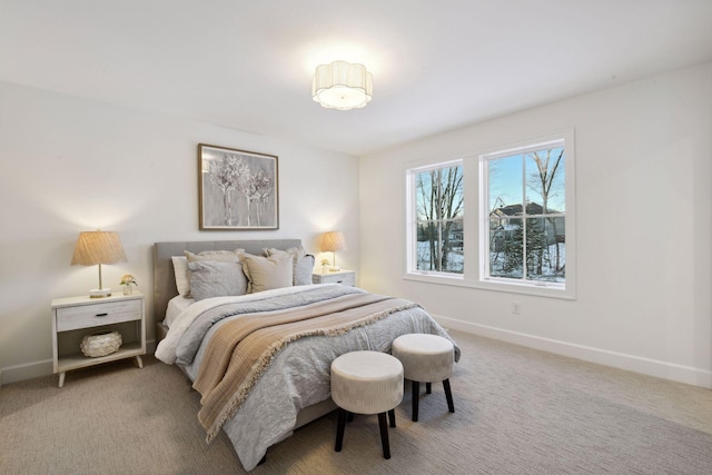 carpeted bedroom featuring baseboards