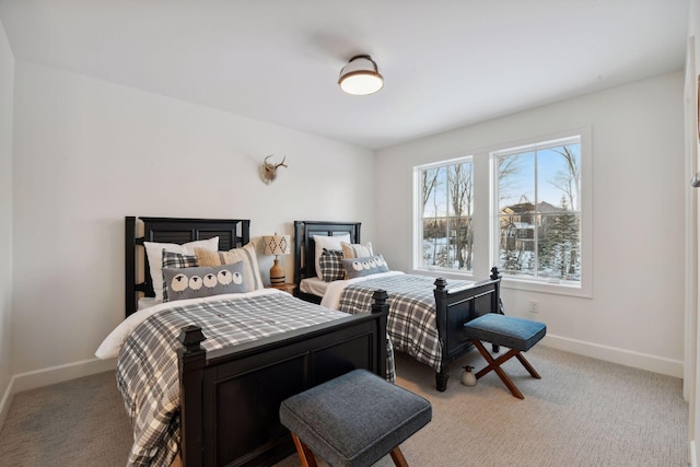 carpeted bedroom with baseboards