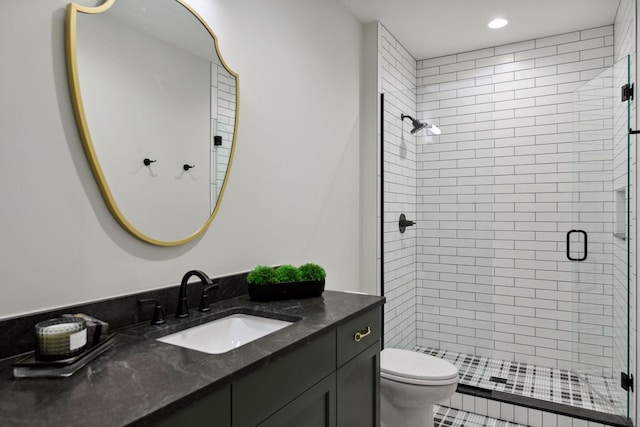 bathroom featuring a stall shower, vanity, toilet, and recessed lighting