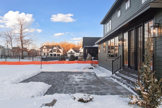 exterior space featuring a residential view, a patio area, and fence