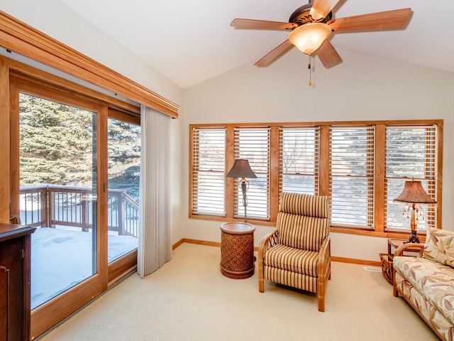 sitting room featuring carpet floors, a wealth of natural light, and vaulted ceiling