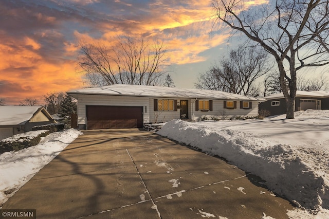 view of front of home featuring a garage and concrete driveway