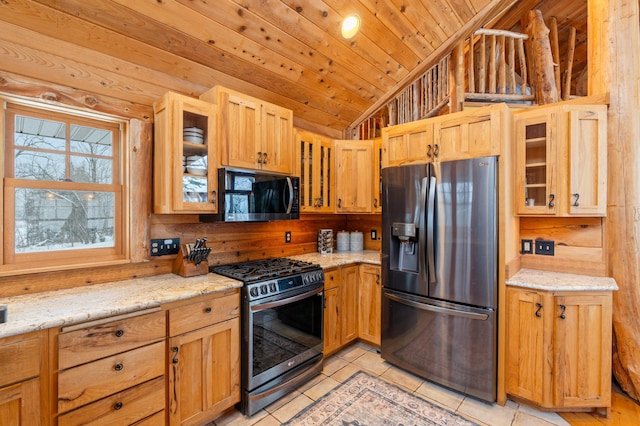 kitchen with vaulted ceiling, wooden ceiling, light tile patterned floors, glass insert cabinets, and appliances with stainless steel finishes
