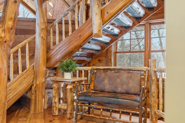 sitting room featuring wood finished floors and lofted ceiling
