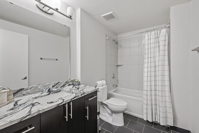 full bathroom featuring visible vents, toilet, shower / bath combo, vanity, and tile patterned floors