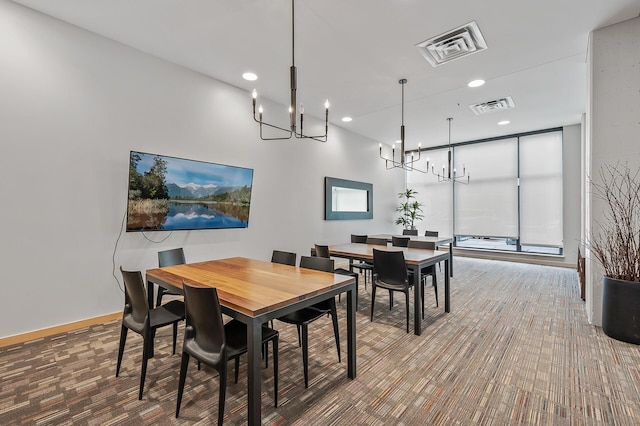 dining area featuring recessed lighting, visible vents, a notable chandelier, and baseboards