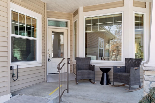 view of exterior entry with a porch