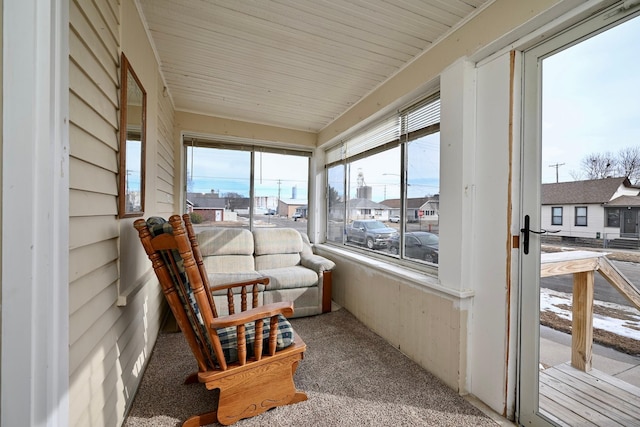 sunroom with a residential view