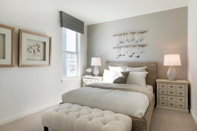 bedroom featuring carpet floors and baseboards