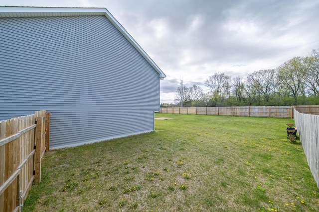 view of yard with a fenced backyard