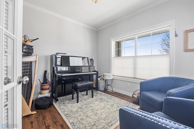 living area featuring baseboards, wood finished floors, and ornamental molding