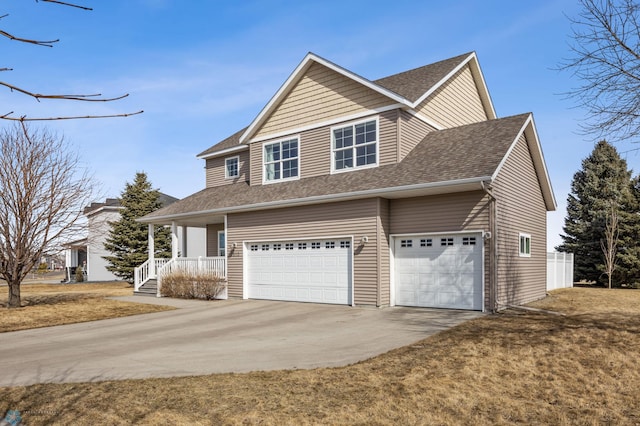 view of front of home featuring a garage, roof with shingles, and driveway