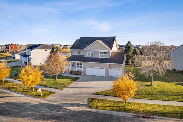 traditional home with a residential view, a garage, driveway, and a front yard