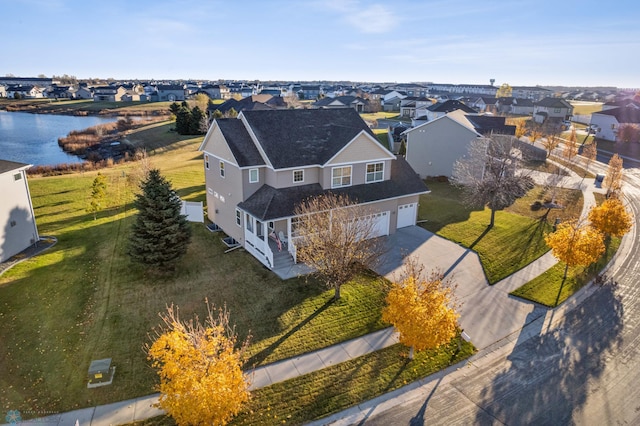 aerial view with a residential view and a water view