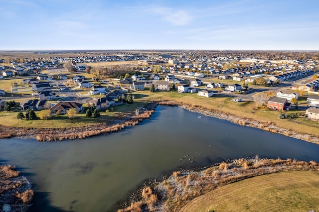 bird's eye view with a residential view and a water view