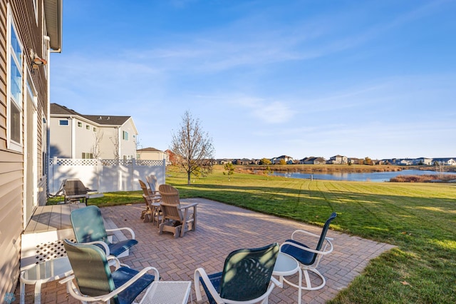 view of patio / terrace featuring a water view and a residential view