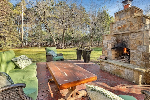 view of patio with an outdoor stone fireplace