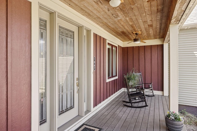 deck featuring covered porch and ceiling fan