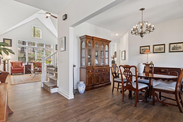 dining room with stairway, dark wood-style floors, high vaulted ceiling, ceiling fan, and baseboards