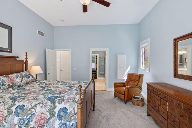 bedroom with light carpet, ceiling fan, and baseboards