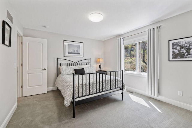 carpeted bedroom with baseboards