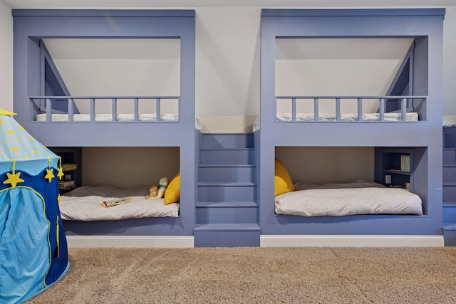 bedroom featuring carpet floors and baseboards