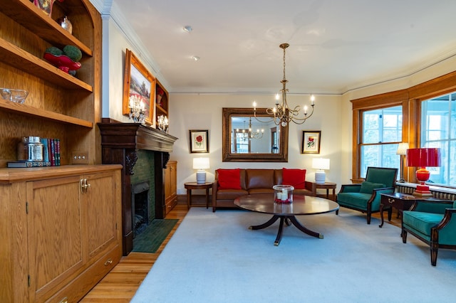 living room featuring a chandelier, a fireplace with flush hearth, light wood-style flooring, and crown molding