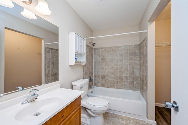 full bath with vanity, shower / tub combination, and toilet
