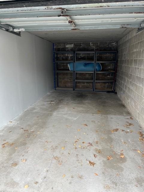 garage with concrete block wall