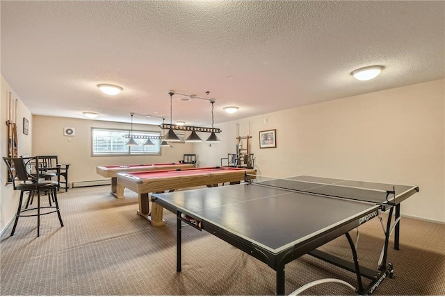 playroom with carpet floors, a textured ceiling, and baseboard heating