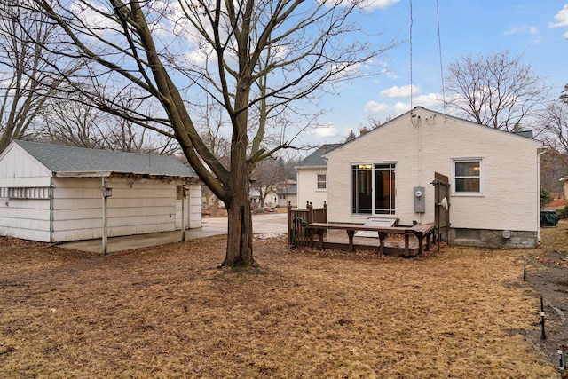 back of property featuring a deck